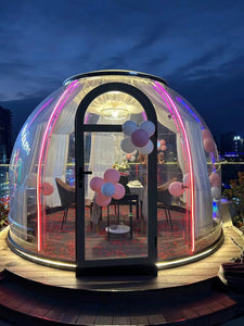 Earth Haven decorated transparent pod with balloons and ambient lighting.