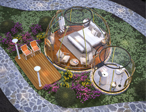 Aerial view of luxury glamping site with multiple transparent dome pods surrounded by lush gardens and equipped with modern outdoor furniture on a stone path, ideal for eco-tourism and nature retreats.